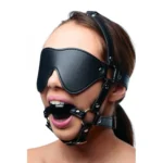 Strict Blindfold Harness And Ball Gag. Unleash new sensations with the Blindfold Harness and Ball Gag.