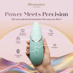 Close-up of Womanizer Next showing stimulation head, controls for Climax Control and Autopilot, and extra stimulator head size