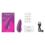 Close-up of the Box Content Womanizer Starlet 3 showing two-button controls, magnetic USB charging pins and waterproof IPX7 design