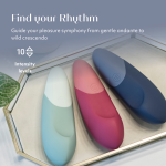 Close-up of Womanizer Vibe showing Pleasure Edges ergonomic shape, Autopilot controls and magnetic USB charging pins in body-safe silicone